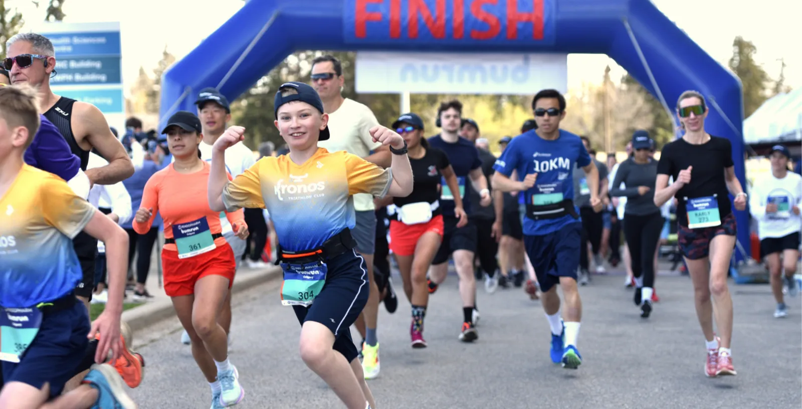 Runners crossing the Bumrun finish line